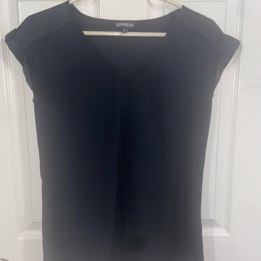 Black silky type material shirt.